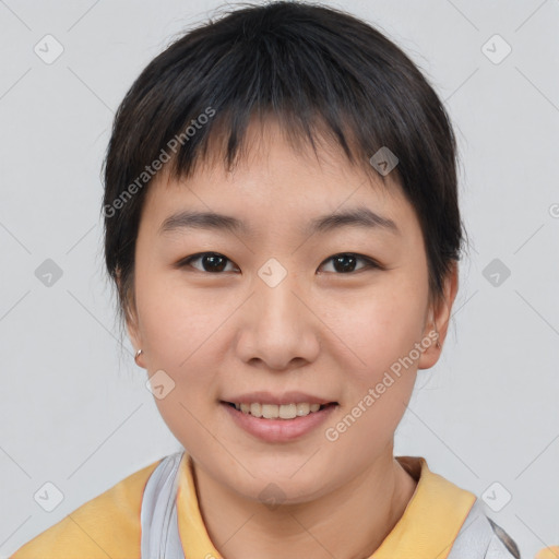 Joyful asian young-adult female with short  brown hair and brown eyes
