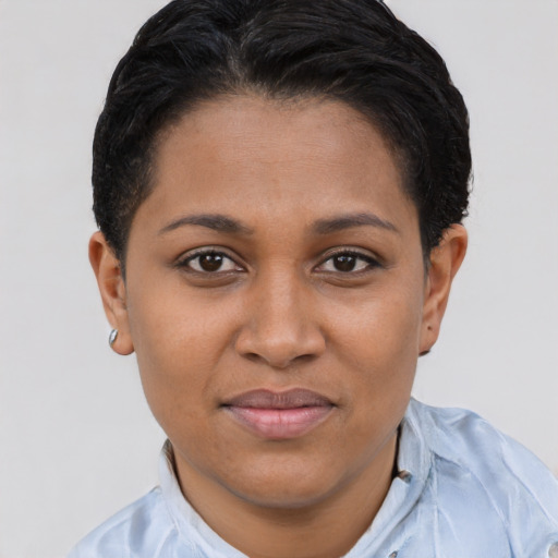 Joyful latino young-adult female with short  brown hair and brown eyes