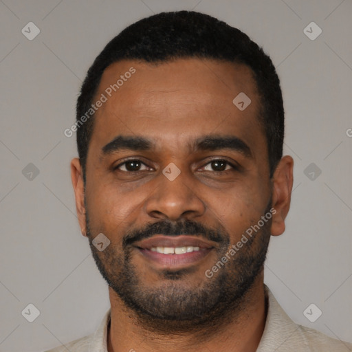 Joyful black young-adult male with short  black hair and brown eyes