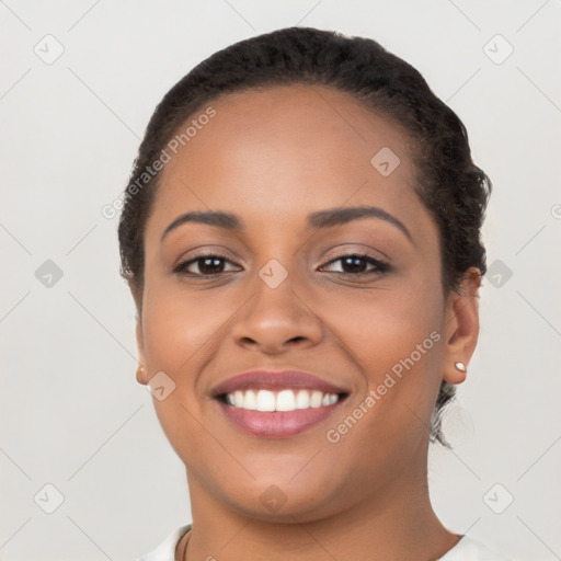 Joyful latino young-adult female with short  black hair and brown eyes