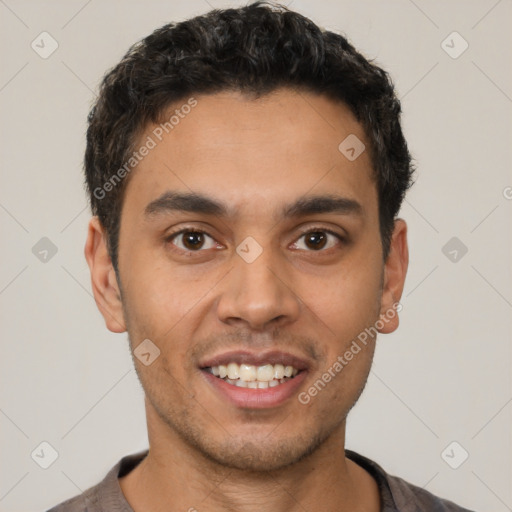 Joyful latino young-adult male with short  brown hair and brown eyes
