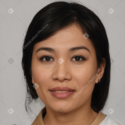 Joyful asian young-adult female with medium  black hair and brown eyes