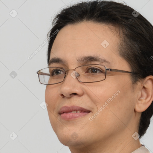 Joyful white adult female with short  brown hair and brown eyes