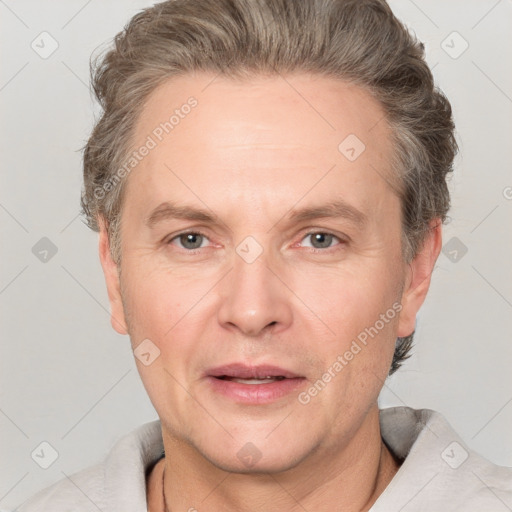 Joyful white adult male with short  brown hair and grey eyes