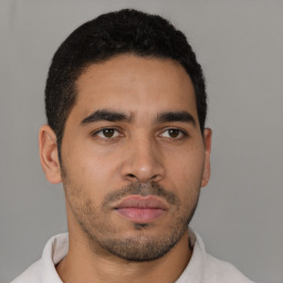 Neutral latino young-adult male with short  black hair and brown eyes
