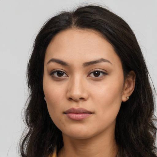 Neutral latino young-adult female with long  brown hair and brown eyes