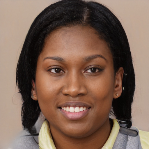 Joyful latino young-adult female with medium  black hair and brown eyes