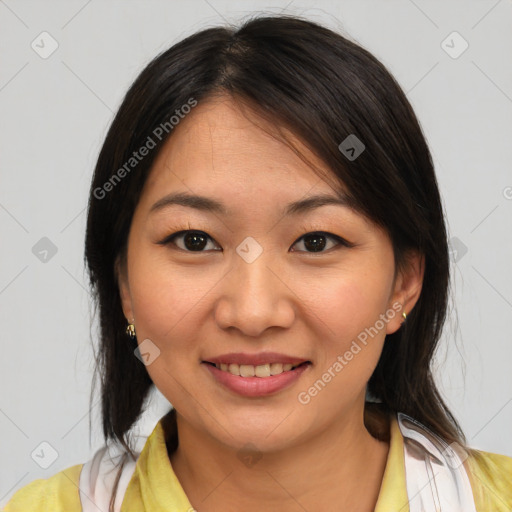 Joyful asian young-adult female with medium  brown hair and brown eyes