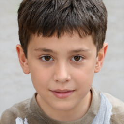 Joyful white child male with short  brown hair and brown eyes