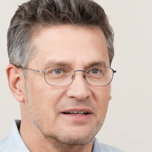 Joyful white adult male with short  brown hair and grey eyes