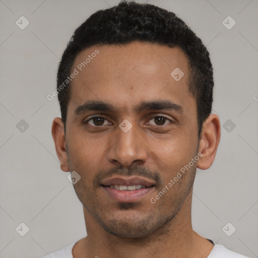 Joyful black young-adult male with short  black hair and brown eyes