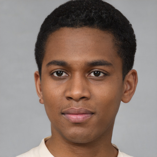 Joyful latino young-adult male with short  brown hair and brown eyes