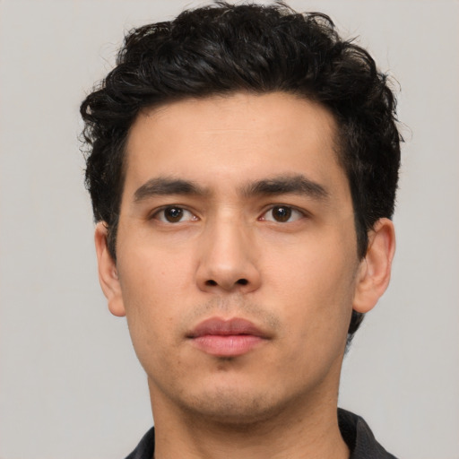 Neutral white young-adult male with short  black hair and brown eyes