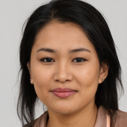 Joyful asian young-adult female with medium  brown hair and brown eyes