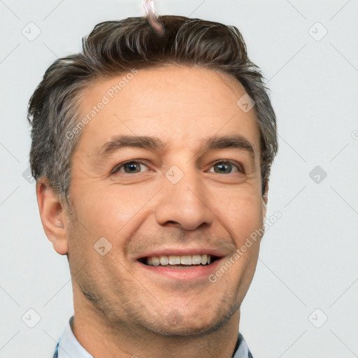 Joyful white adult male with short  brown hair and brown eyes