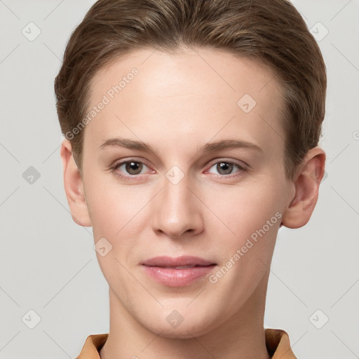 Joyful white young-adult female with short  brown hair and grey eyes