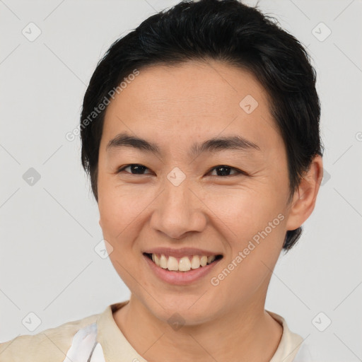 Joyful asian young-adult female with short  brown hair and brown eyes