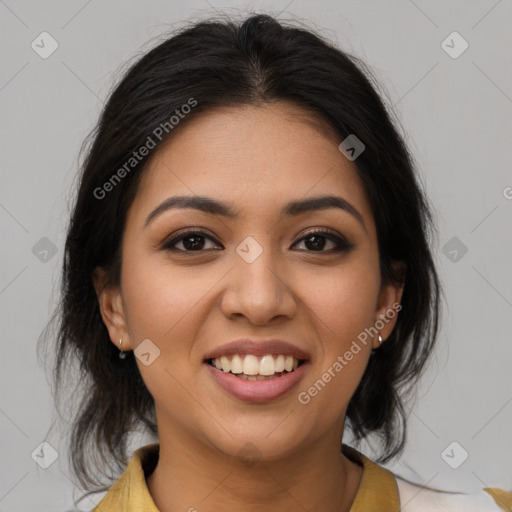 Joyful latino young-adult female with medium  brown hair and brown eyes