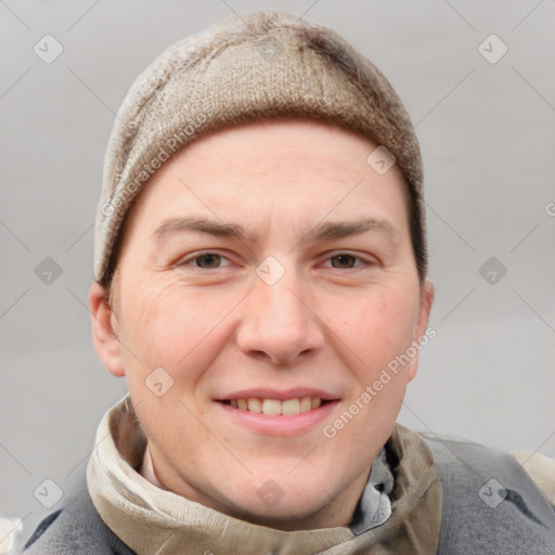 Joyful white adult male with short  brown hair and grey eyes