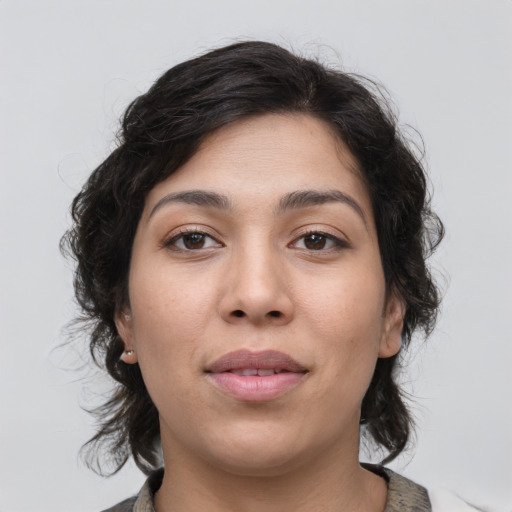 Joyful asian young-adult female with medium  brown hair and brown eyes