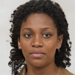 Neutral black young-adult female with long  brown hair and brown eyes