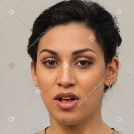 Joyful latino young-adult female with short  brown hair and brown eyes