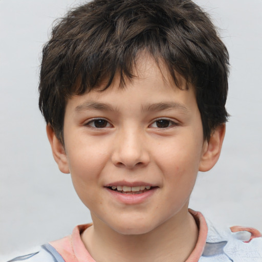 Joyful white child male with short  brown hair and brown eyes