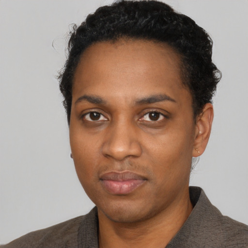 Neutral black young-adult female with short  black hair and brown eyes