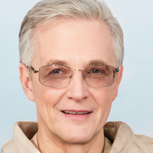 Joyful white middle-aged male with short  gray hair and blue eyes