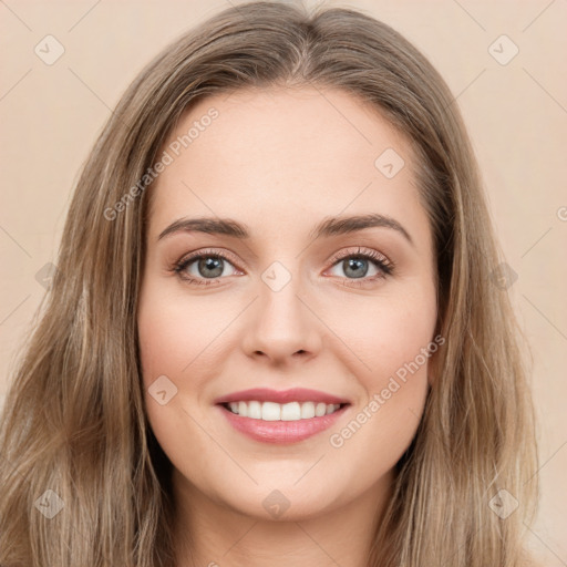 Joyful white young-adult female with long  brown hair and green eyes