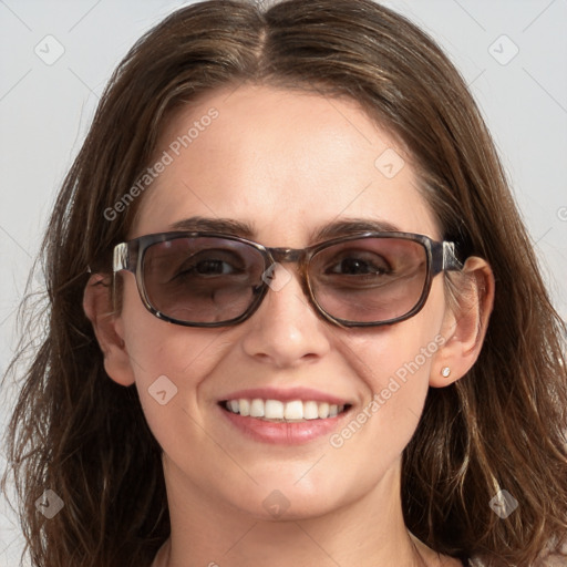 Joyful white young-adult female with long  brown hair and blue eyes