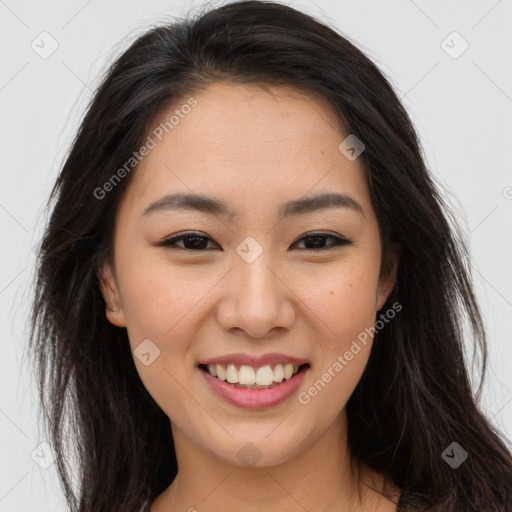 Joyful asian young-adult female with long  brown hair and brown eyes