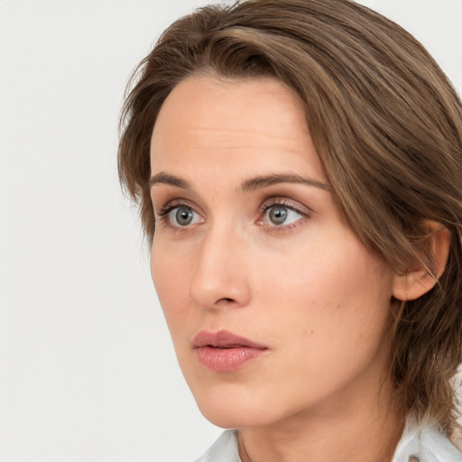 Neutral white young-adult female with medium  brown hair and blue eyes