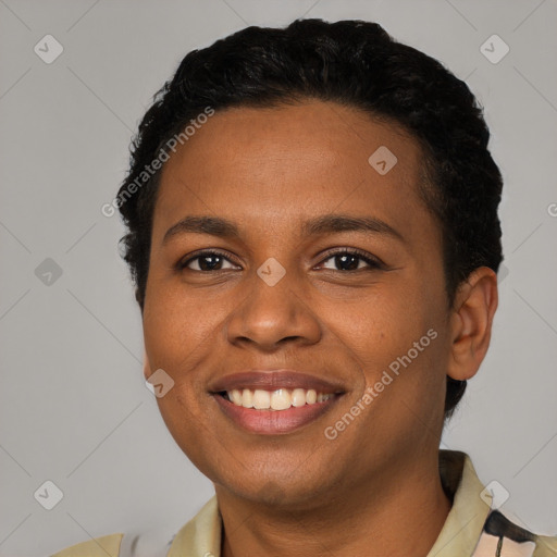 Joyful black young-adult female with short  brown hair and brown eyes