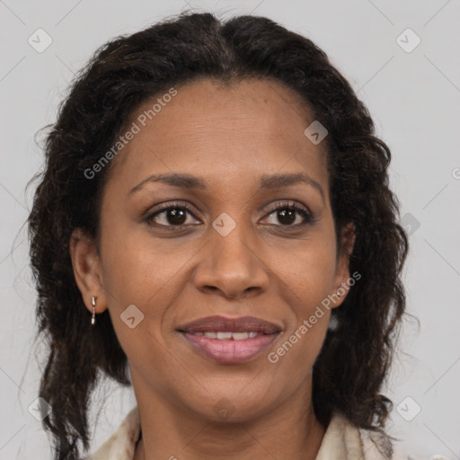 Joyful latino adult female with medium  brown hair and brown eyes