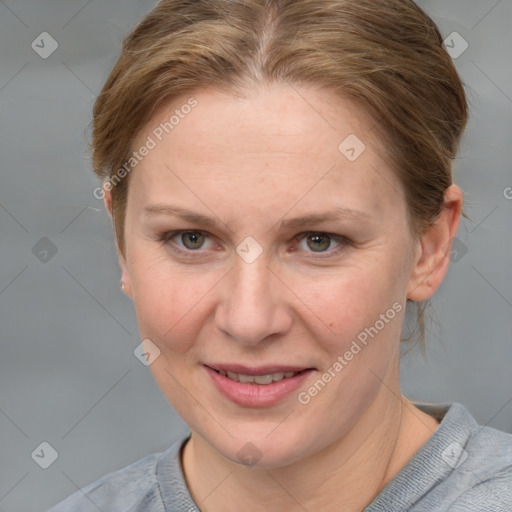 Joyful white adult female with medium  brown hair and blue eyes