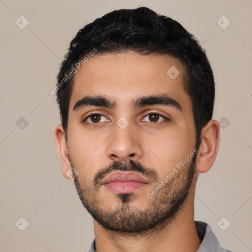 Neutral latino young-adult male with short  black hair and brown eyes