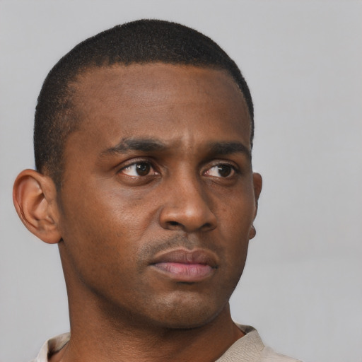 Neutral black young-adult male with short  black hair and brown eyes