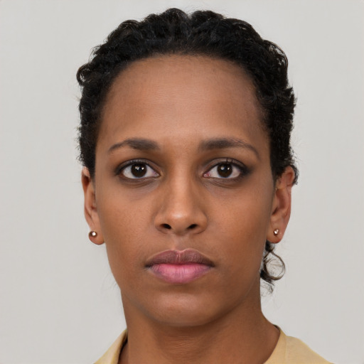 Neutral black young-adult female with short  black hair and brown eyes