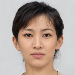 Neutral asian young-adult female with medium  brown hair and brown eyes