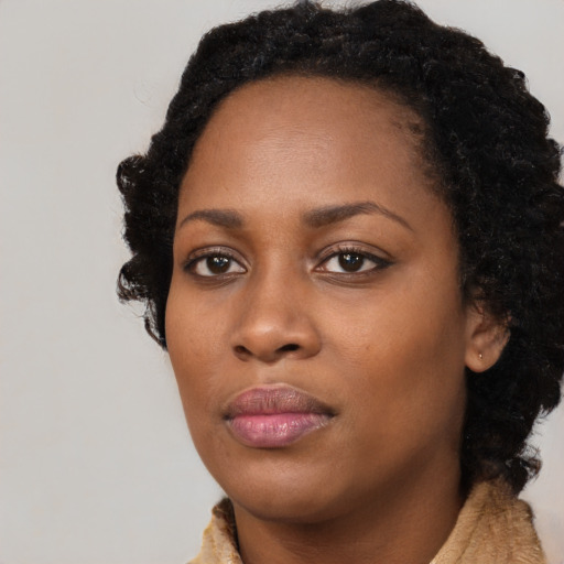 Neutral black young-adult female with long  black hair and brown eyes