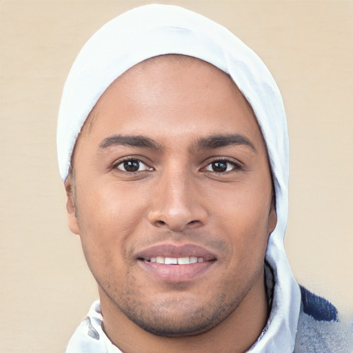 Joyful white young-adult male with short  black hair and brown eyes