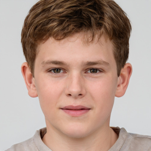 Joyful white child male with short  brown hair and grey eyes