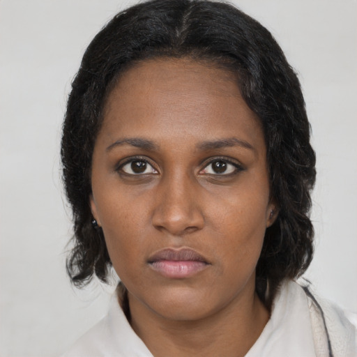 Neutral black young-adult female with medium  black hair and brown eyes