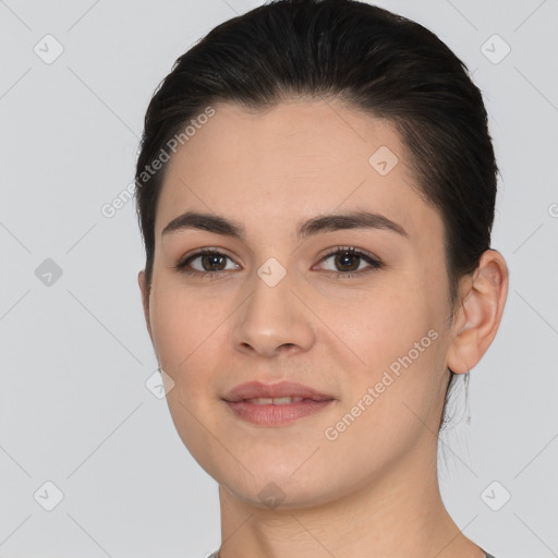 Joyful white young-adult female with short  black hair and brown eyes