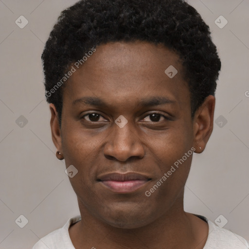 Joyful black young-adult male with short  black hair and brown eyes