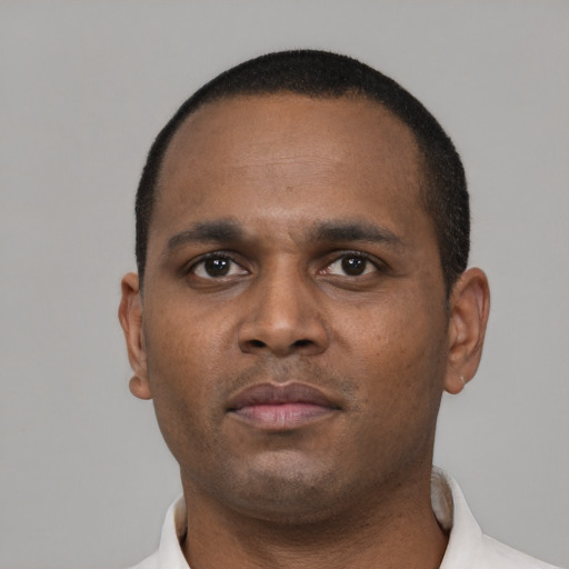 Neutral black young-adult male with short  black hair and brown eyes