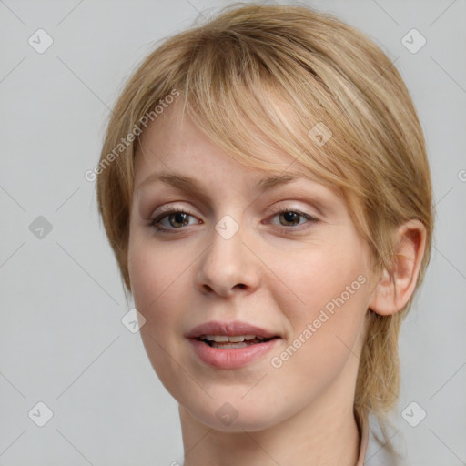 Joyful white young-adult female with medium  brown hair and blue eyes