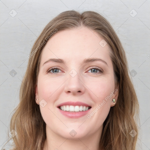 Joyful white young-adult female with long  brown hair and grey eyes