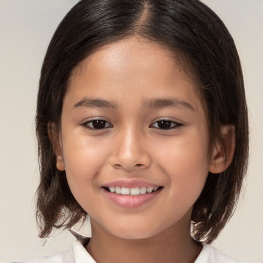 Joyful white child female with medium  brown hair and brown eyes